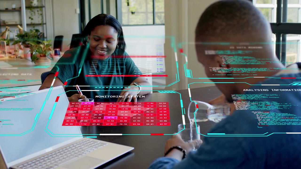 AR overlay appearing triggers colleagues, woman writing and smiling as man gesturing to review data