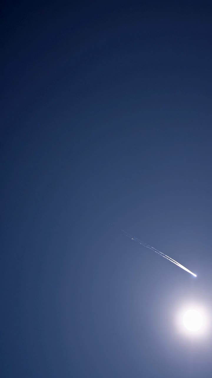 A minimalistic video concept featuring a meteor streaking across a clear blue sky
