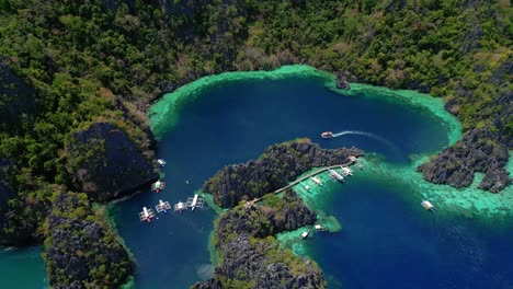 cinematic aerial drone flyover of limestone islands in coron, palawan, philippines – horizontal view of turquoise water and tropical coastal landscape