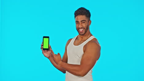 Green-screen,-phone-and-man-flex-isolated-on-blue