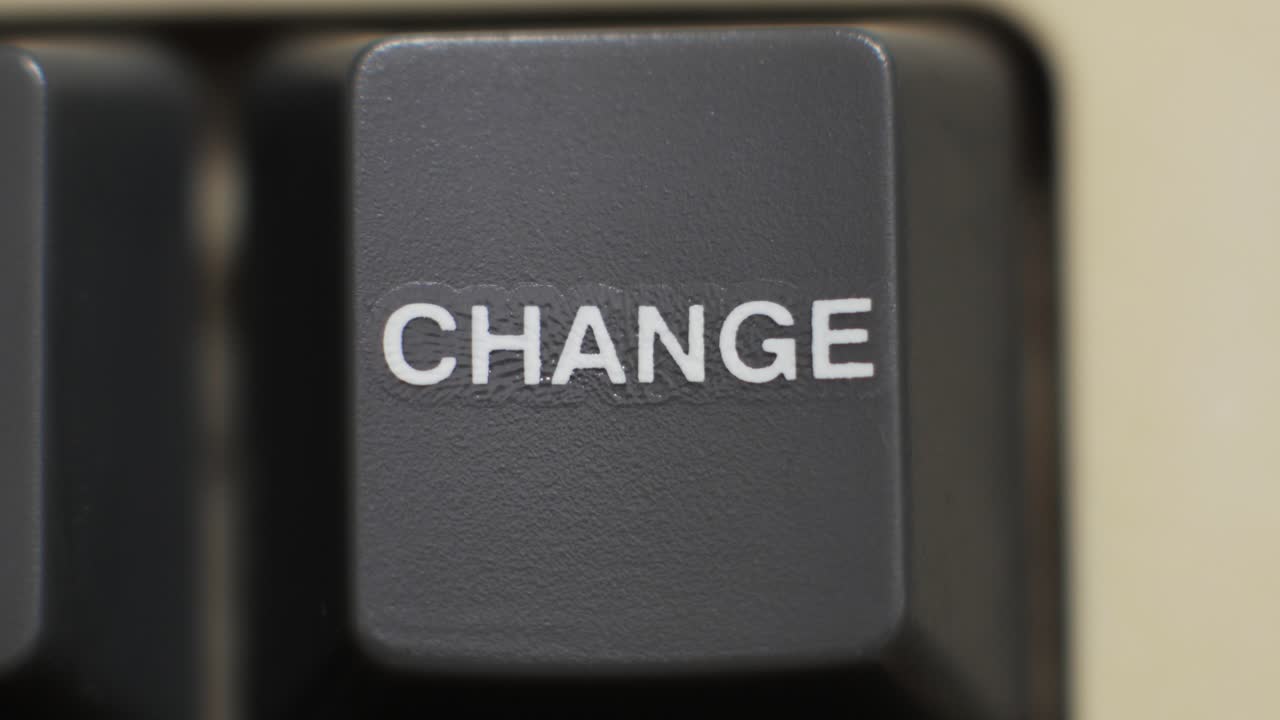 Macro close up of a Change key being pressed to symbolize habit change and new life choices