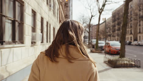 woman walking down a city street