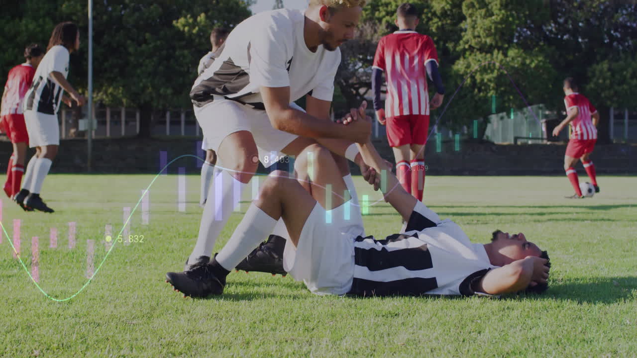 Helping injured teammate on field, soccer player with data animation overlay
