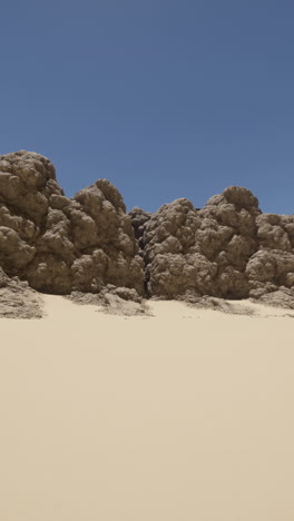 arid landscape with sand dunes and rock formations