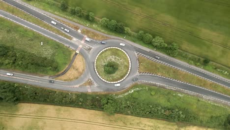 4K-aerial-footage-of-a-junction-on-the-A64-near-Scarborough-with-cars-and-trucks-and-green-countryside