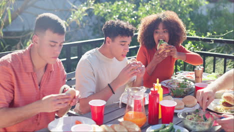 friends enjoying hamburgers at a picnic