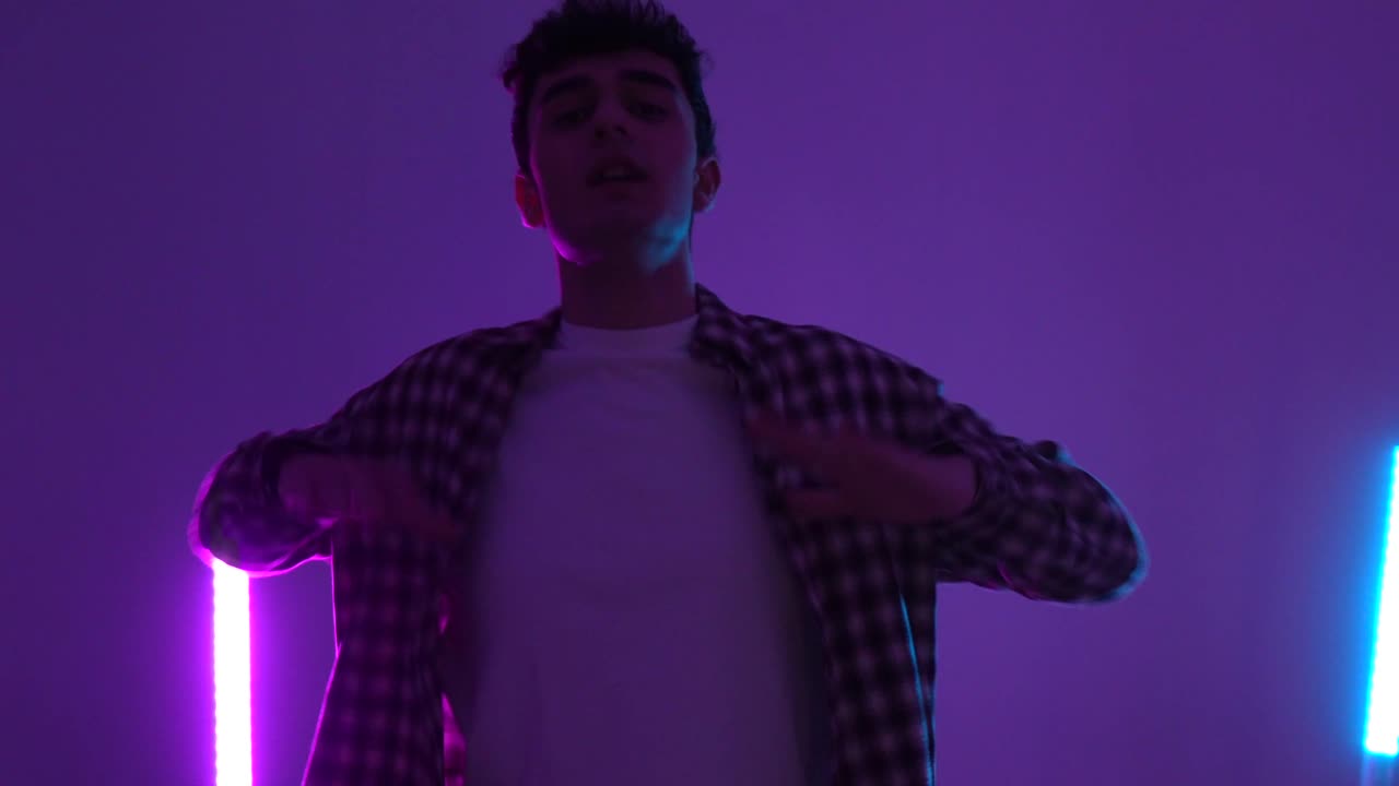 Man dancing in neon lighting