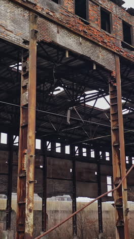 abandoned ruined industrial factory building, ruins and demolition concept. aerial view vertical video