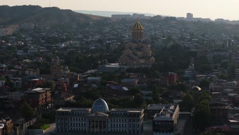 amazing aerial view of holy trinity cathedral of tbilisi at sunrise