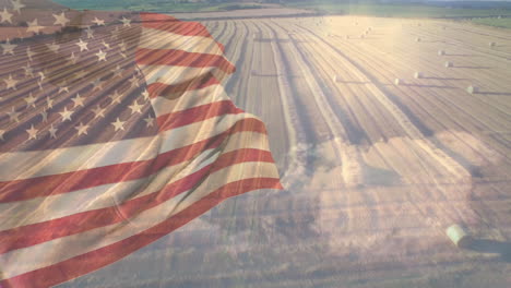 animation of flag of america blowing over ploughed field with hay bales