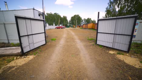 construction site with wooden houses and metal sheds