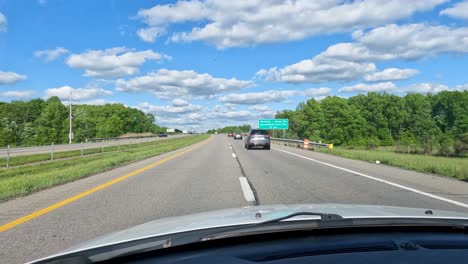 driving on highway during beautiful sunny day with blue sky.