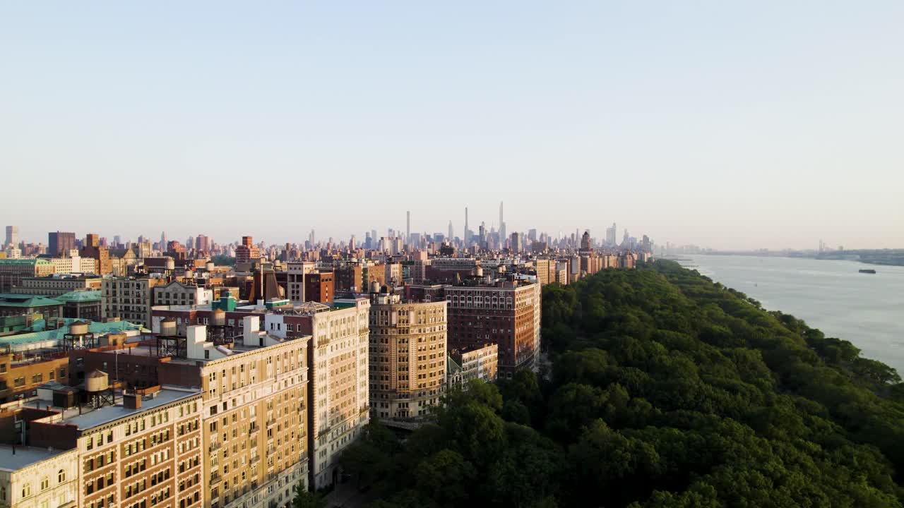 Beautiful aerial pan shot of Manhattan at golden hour