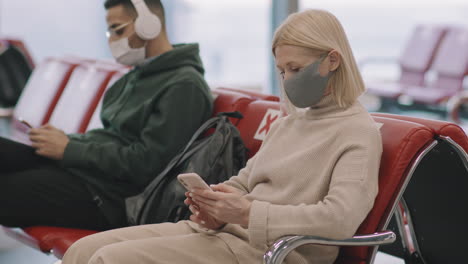 people waiting in departure lounge