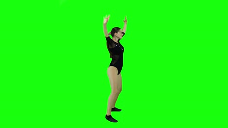 quick and energetic female dancer from the side dancing in front of a green screen