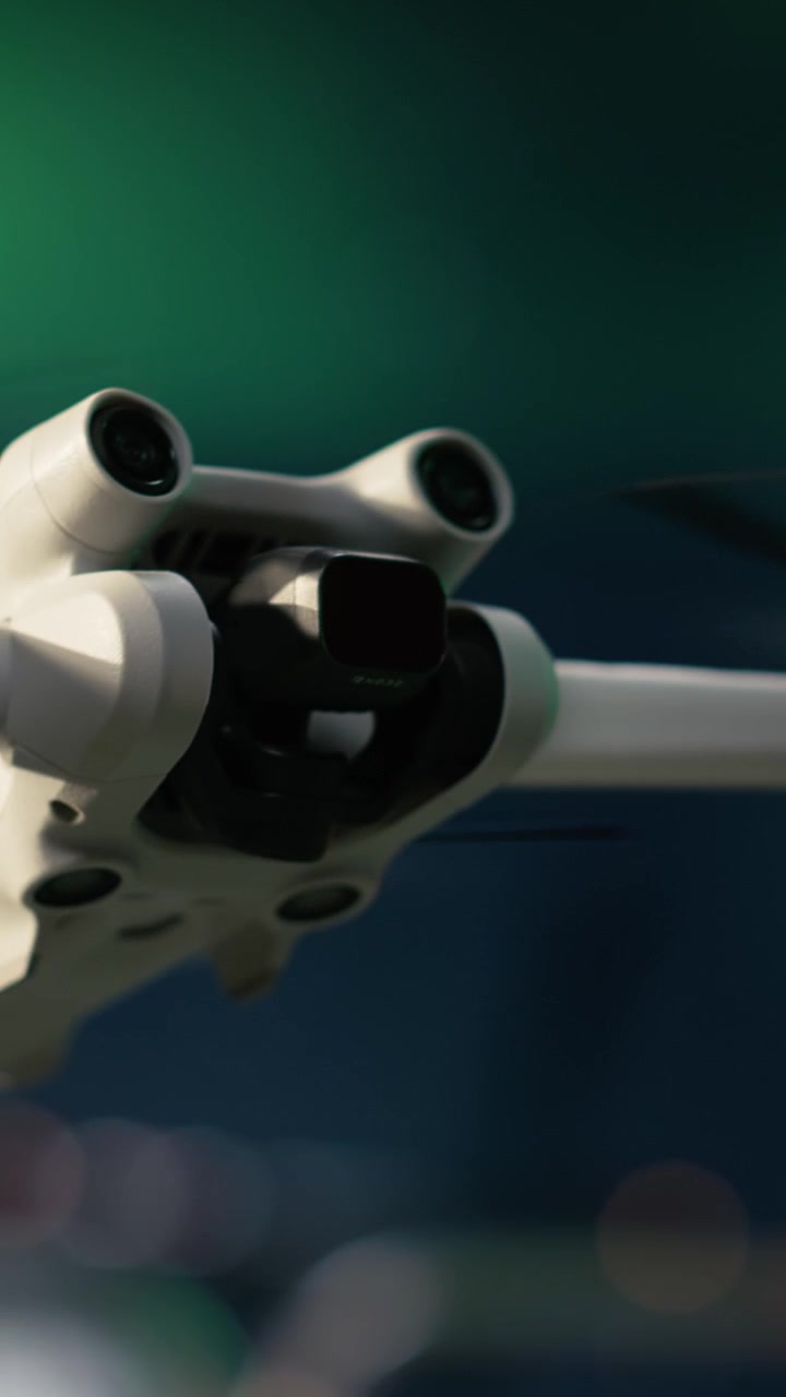 Vertical video Finding fossil reserves during oil crisis, drone close up and offshore platform