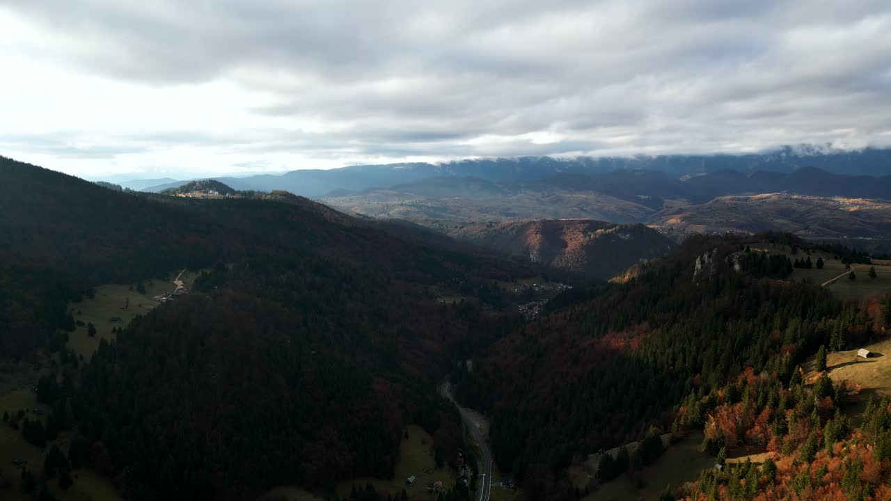 Cloudscape Over Carpathian Mountains During Autumn In Moieciu de Sus, Romania. Aerial Drone Shot
