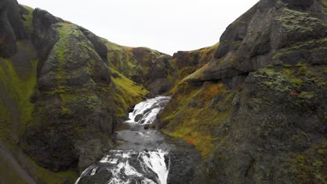 Verdant-rocky-canyon-and-whitewater-Stjornarfoss-waterfall-in-Iceland