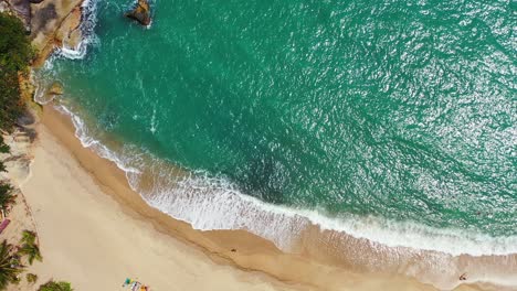 Waves-lapping-on-the-golden-sand-beach,-Koh-Phangan,-Thailand