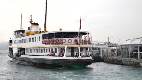 a ferry boat docks at a port in istanbul, turkey