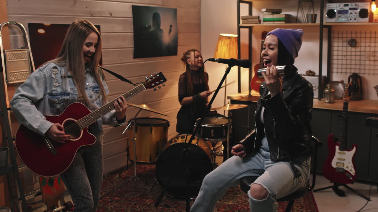 Female Music Band Performing In Studio