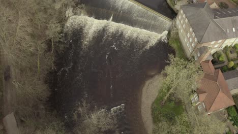 aerial-drone-shot-of-river-water-flowing-through-cascade-and-waterfall