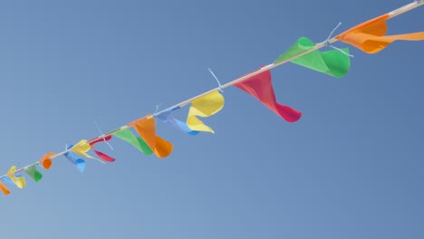 many flags on the wind waving beach decoration close-up