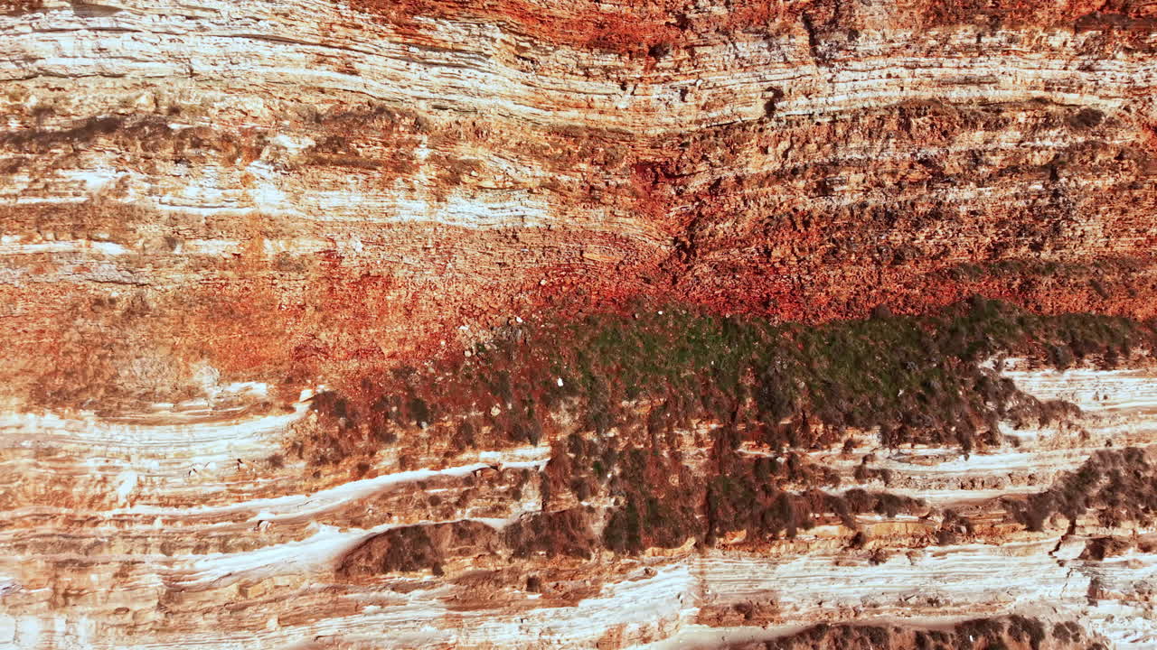 Layers of earth reveal history in the rocks showing patterns of sediment from different periods in nature's cycle