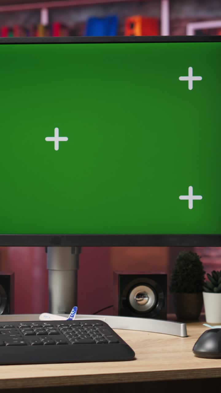 Vertical video Chroma key computer display in loft with shelves filled with books in background