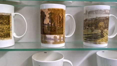 beautiful collection of mugs on glass shelves, motion view