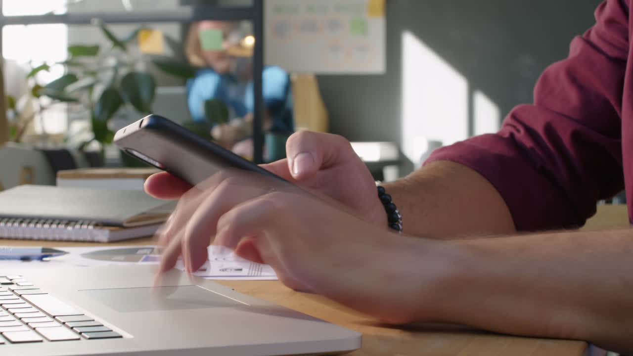 Timelapse of Using Laptop and Smartphone in Office