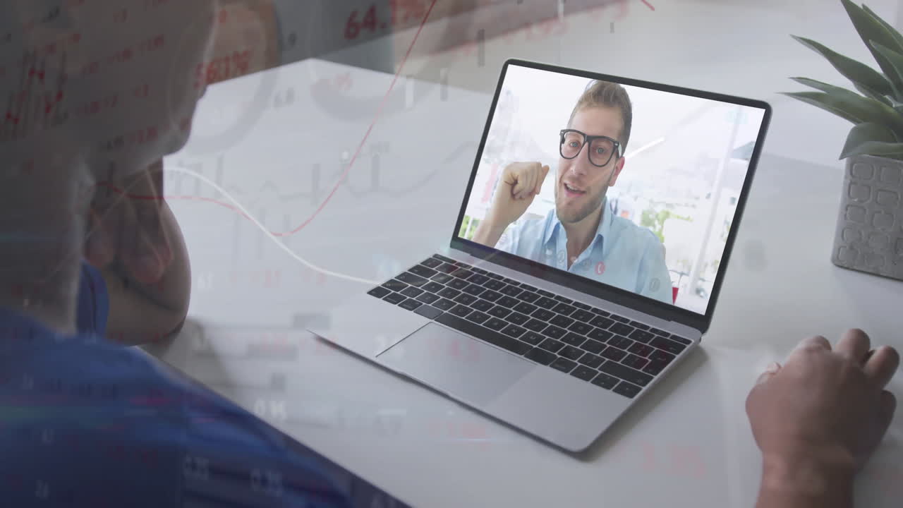 Having video call, person using laptop with financial data animation overlay