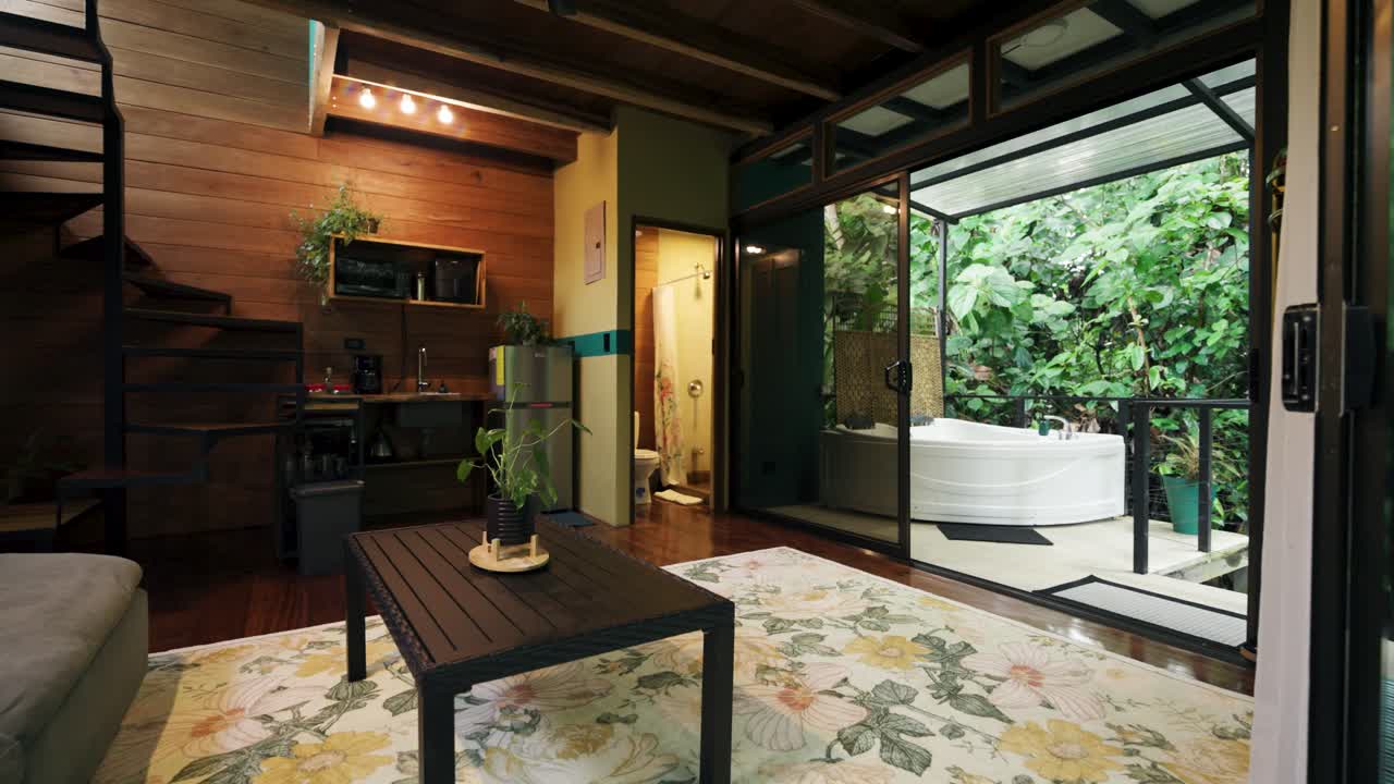 Cozy Living Room Interior with Spiral Staircase and Outdoor Bathtub