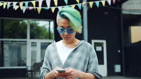 young woman texting on mobile phone