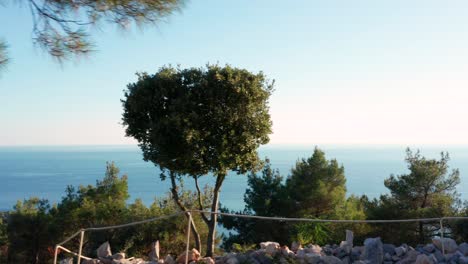 aerial truck shot along a high ridge looking out towards the sea on losinj island, croatia