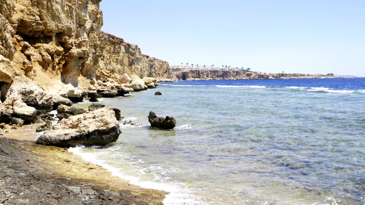 Sea coast with rough cliffs