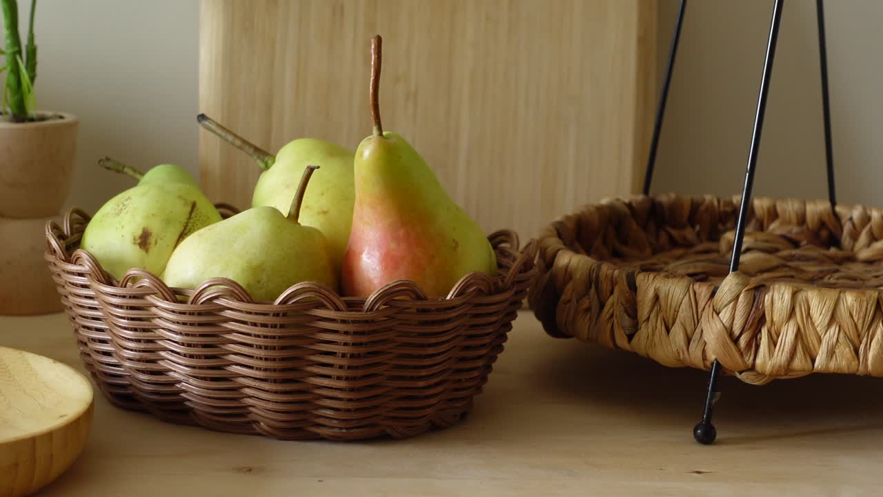 Pears in a Woven Basket on a Wooden Table