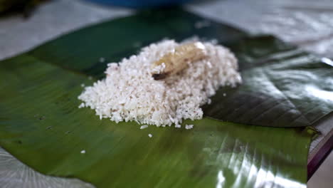 Preparation-of-rice-and-banana-animal-food-in-palm-leaf-for-elephants