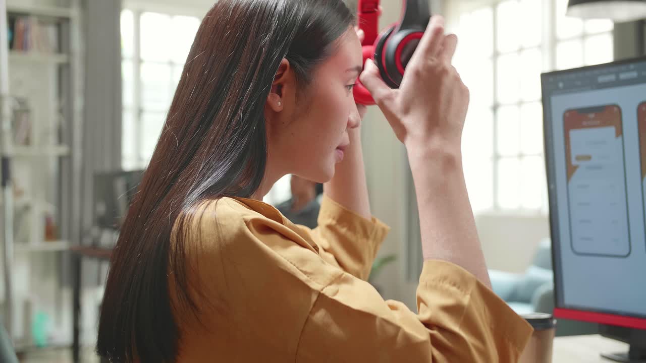 Asian Female Mobile Application Developer Start Works With Graphics On Her Personal Computer In Office