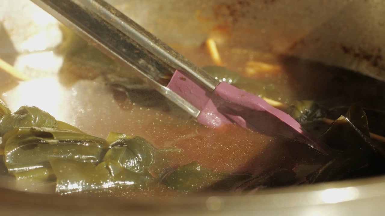 Traditional chinese spicy chicken gizzards close-up. Asian chicken stomach popular food. Local street food market outdoor. High quality 4k footage