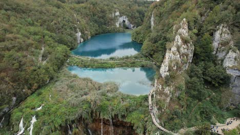 River-waterfall-cascade-in-lush-mountain-canyon-in-Plitvice,-Croatia