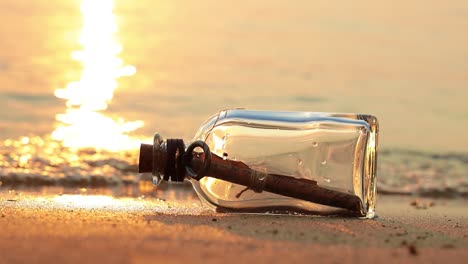 Message in a bottle on the coast at sunset. Message concepts.