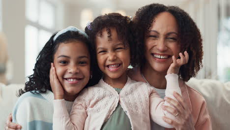 happy family portrait: mother and daughters smiling joyfully together