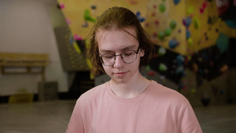 teenage boy in a climbing gym