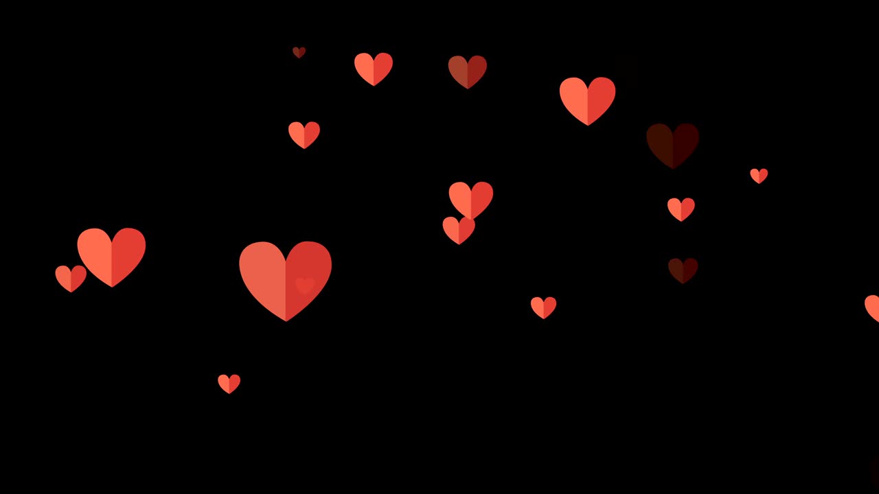 검은 바탕에 빨간색과 분홍색의 심장이 있습니다.