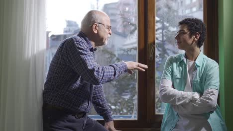 the young man who spends a pleasant and fun time with his grandfather is happy.