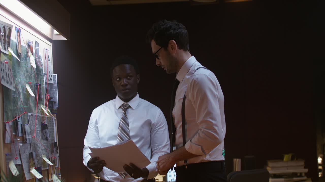 Two Detectives Discussing a Case at a Crime Scene