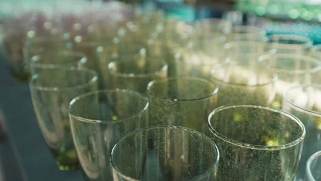 empty green champagne flutes displayed