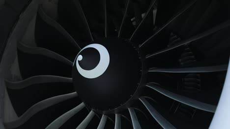 close shot captures the airplane engine spinning slowly, showcasing its intricate details and mechanical beauty