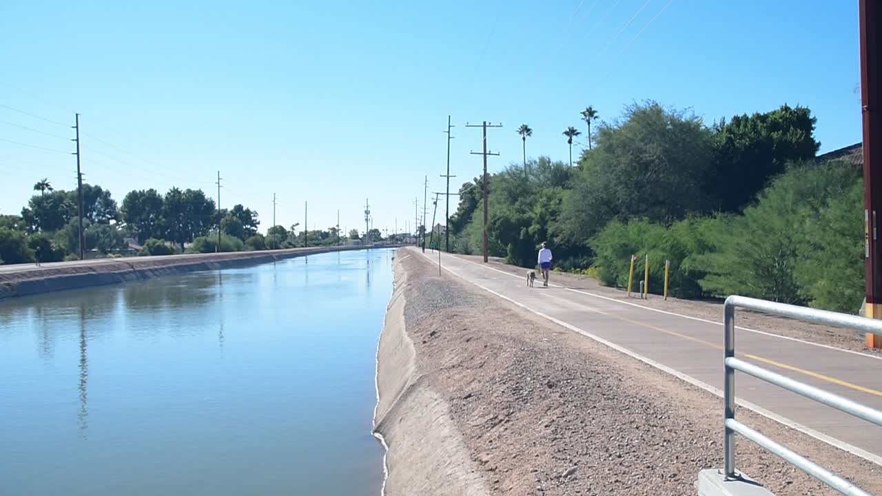 Walking the dog along the Scottsdale Arizona Trail Canal.